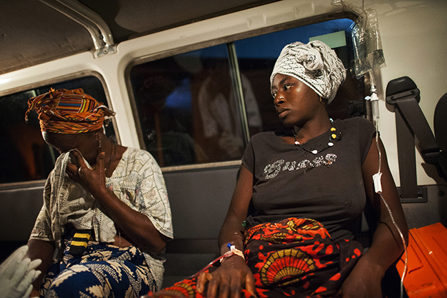 A 22-year-old woman, right, is brought by ambulance to MSF’s Gondama Referral Center from a government clinic after suffering a miscarriage. Her mother, left, accompanies her. Photo by Lynsey Addario/VII
