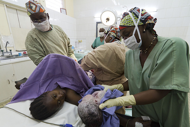 A baby is delivered by C-section to a mother in Rutshuru, Democratic Republic of Congo. Photo by Andre Quillien/MSF