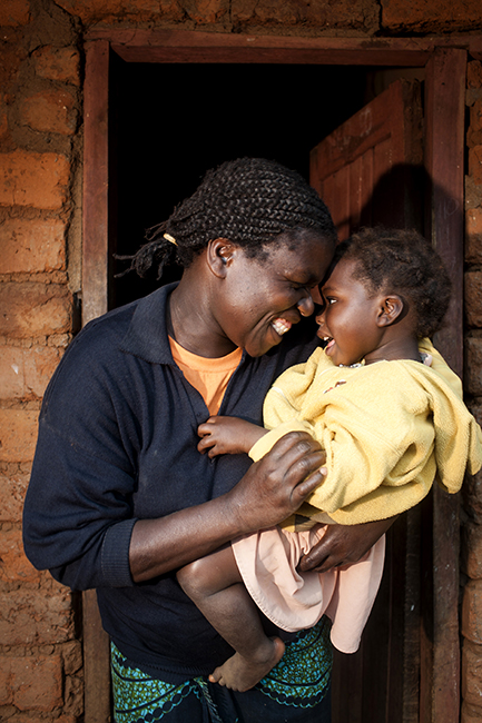 Edna, A PMTCT patient, holds her daughter in Malawi. Photo by Sydelle Willow Smith