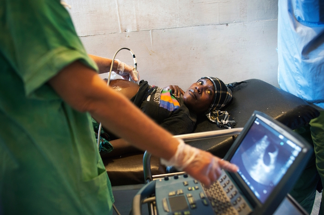 Dr. Raney performs a sonogram for a pregnant woman at the Gondama Referral Center in Bo. Photo by Lynsey Addario