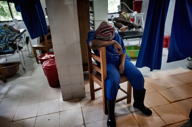 An exhausted staff member takes a break at the Gondama Referral Center. Photo by Lynsey Addario